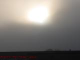 Morning Sun as a Headlight in Clouds, Cambridge, Mass.