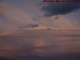 Layered Sunset Clouds With Jet On Approach