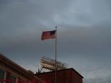 Sunset Lighted Flag Over Fenway Park in a Strong West Wind