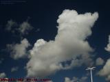 Poodle Clouds on Dark Azure Skies Over the Parking Garage