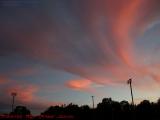 Wispy Sprites Inhabiting Sunset Sky Over Tillar Field
