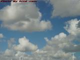 Distant Seaplane Under Clouds Beyond the Parking Garage