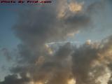 Natural and Artificial Clouds in Late Day Sun, Sunrise